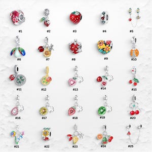 May include: A collection of twenty-five silver-toned metal charms featuring various nature-inspired designs including strawberries, ladybugs, sunflowers, cherries, and clovers, each numbered from one to twenty-five on a white background.