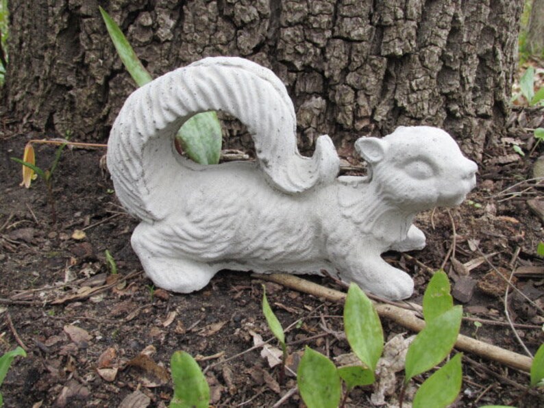 cement squirrel statue