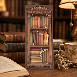 May include: A vertical rectangular bookmark featuring a detailed illustration of a wooden bookcase with three shelves filled with colorful books in various shades of green, brown, yellow, and purple, accented with small potted plants and vines.