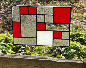 Geometric red and clear stained glass