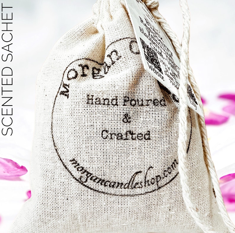 May include: A white cotton drawstring bag with a brown label that says "Morgan Candleshop.com" and "Hand Poured & Crafted".