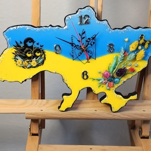 Horloge murale exclusive en forme de carte de pays