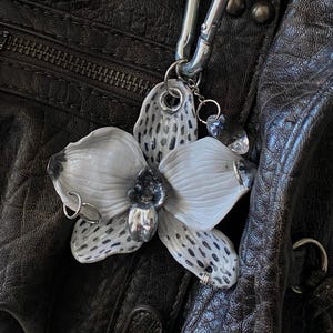 Handmade Orchid Bag Charm – Polymer Clay Flower Keychain with Piercing & Crystal, Bold Accessory 2025