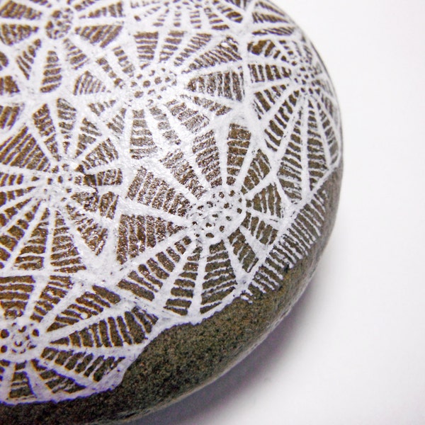 coral ocean painted rock as a paperweight