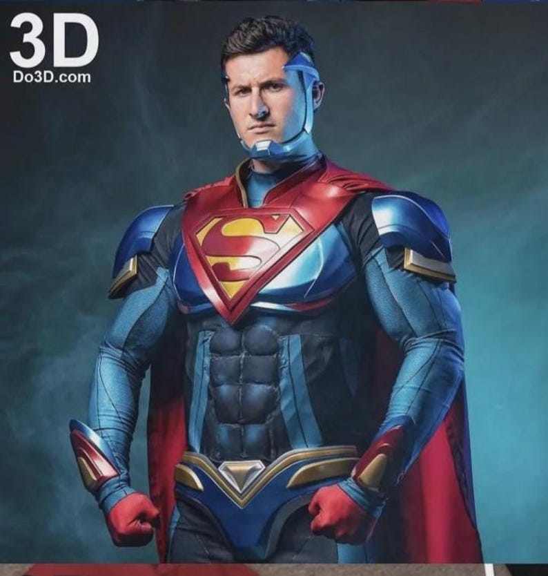 May include: A person in a Superman-inspired costume. The costume is mainly blue with red and gold details, featuring a red cape and the iconic "S" emblem on the chest. The image includes the text "3D Do3d.com" in the upper left corner.