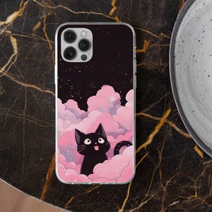 May include: A black cat with a surprised expression sits on pink clouds with white stars against a dark blue background with white stars. The image is on a clear phone case.