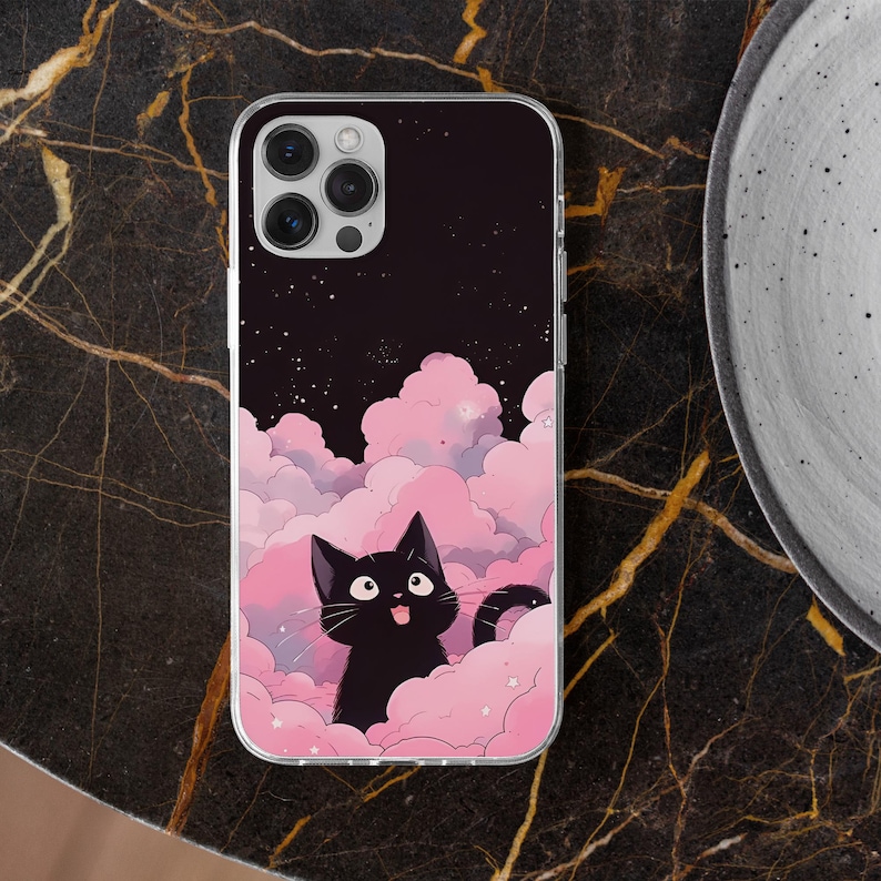 May include: A black cat with a surprised expression sits on pink clouds with white stars against a dark blue background with white stars. The image is on a clear phone case.