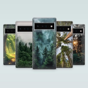 May include: Five different phone cases with forest scenes. The cases are clear and show a variety of forest scenes, including a foggy forest, a forest with tall trees, and a forest with a path.