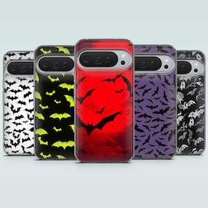 May include: A selection of phone cases with Halloween designs. The cases display patterns of bats, a red moon with bats, and a black and white bat pattern. The cases are arranged in a row, highlighting the different designs.