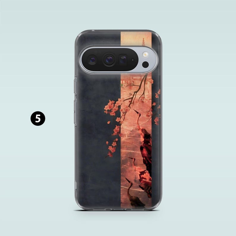 May include: A phone case featuring a dark blue and peach-colored design with a Japanese-inspired illustration. The artwork depicts cherry blossoms, cranes, and a landscape scene. The case has a clear border and a camera cutout.
