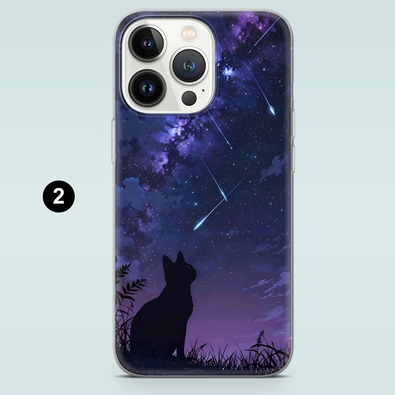 May include: A clear phone case with a black silhouette of a cat looking up at a starry night sky with shooting stars.