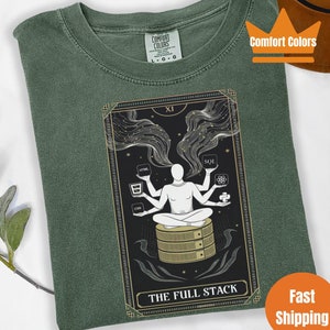 May include: A green t-shirt featuring a graphic of a tarot card depicting a person with multiple arms holding different programming languages. The card is titled "The Full Stack".