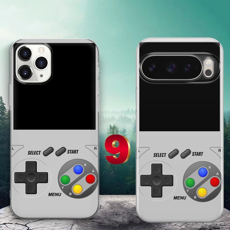 May include: Two light gray phone cases featuring a retro handheld game console design. Each case displays a black top section, a directional pad, four colored action buttons labeled A, B, X, Y, and buttons labeled Select, Start, and Menu.