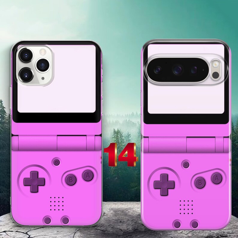 May include: Two pink phone cases featuring a retro handheld gaming console design. The cases display a D-pad, A and B buttons, and a speaker grid. The left case has a triple camera cutout, while the right case has a horizontal camera bar.
