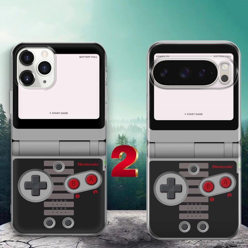 May include: Two clear smartphone cases featuring a retro video game controller graphic. The design includes a black and grey layout with red A and B buttons, the Nintendo logo, and text reading BATTERY FULL and START GAME on the upper section.