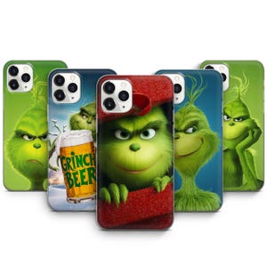 May include: A collection of phone cases featuring the Grinch. The cases display various images of the Grinch, including one with a red hat and another with a mug of "Grinch Beer". The cases are primarily green, with some blue and red accents.
