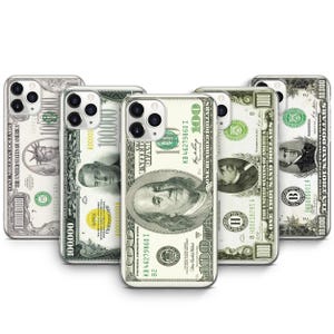 May include: Clear phone cases with a money-themed design. The cases feature images of U.S. currency, including one hundred dollar bills and other denominations. The cases are designed to fit various phone models.