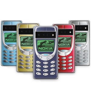 May include: Five vintage cell phones in different colors, including blue, yellow, red, and silver. Each phone has a black and white keypad and a screen displaying the word "NOKIA".