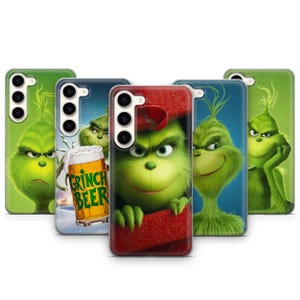 Könnte beinhalten: Eine Auswahl an Handyhüllen mit Grinch-Motiven. Die Hüllen zeigen den Grinch in verschiedenen Posen, mit grünen und roten Farben. Eine Hülle zeigt den Text "Grinch Beer" auf einem Bierkrug.