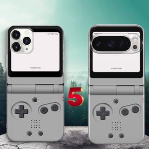 May include: Two grey smartphone cases designed to resemble a vintage handheld gaming console. Each case features a D-pad, A and B buttons, and a speaker grille. The upper portion displays a white screen area with the text "START GAME" and "BATTERY FULL".