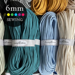 May include: Multiple bundles of 6mm cotton cord in various colors including teal, light blue, cream, and mustard yellow. Each bundle is secured with a white paper band featuring the text Lovely Cottons. The image includes the text 6mm SEWING.