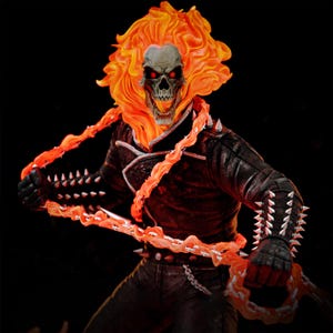 May include: A detailed figurine of Ghost Rider, a comic book character, with a flaming skull head and fiery orange hair. The figure wears a black leather jacket with silver spikes and holds a chain of fire. The background is black.