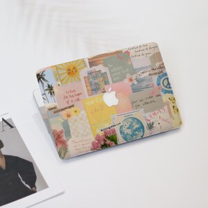 May include: A laptop case with a collage design featuring a sun, palm trees, flowers, and various text snippets. The case has a light color palette with pastel shades of yellow, pink, and blue. The Apple logo is visible.