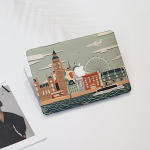 May include: A laptop skin with a colorful illustration of the London skyline, including Big Ben, the London Eye, and a red double-decker bus. The skin has a blue, green, and white color scheme.