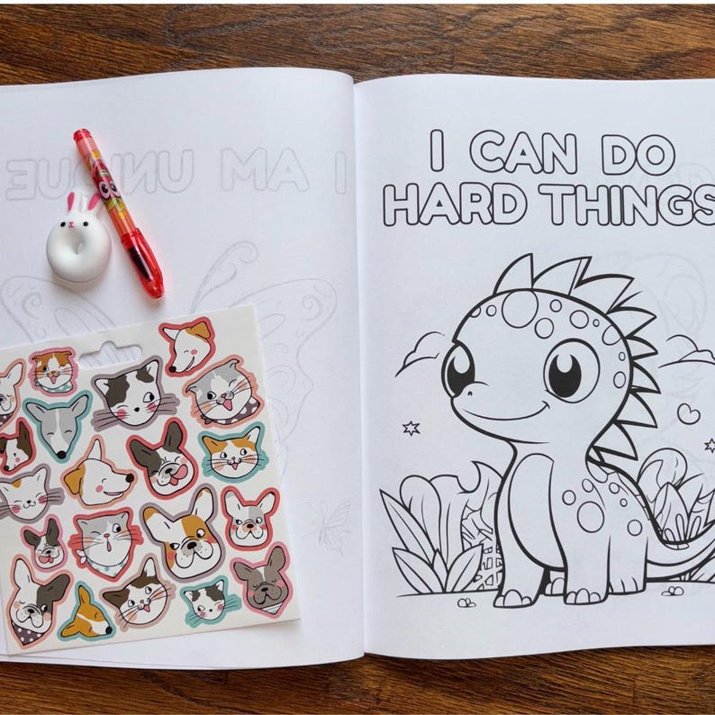 May include: A coloring book with a black and white illustration of a dinosaur with the text "I can do hard things". The book comes with a sheet of stickers featuring various animal faces.