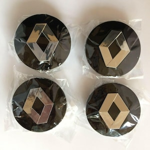 May include: Four black plastic wheel covers with a silver diamond logo in the centre.