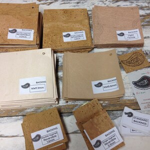 May include: Assortment of cork backing materials for crafts and projects.  The cork is available in various thicknesses, including 0.9mm, 1.1mm, 1.2mm, 1.6mm, and 2.2mm.  The cork is also available in different textures, including light textile, double layered reversible, and single layered reversible.