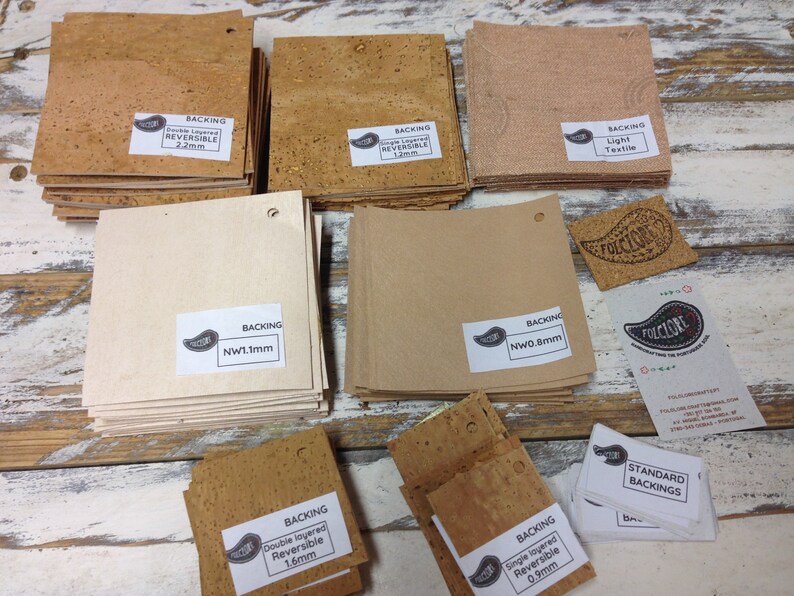 May include: Assortment of cork backing materials for crafts and projects.  The cork is available in various thicknesses, including 0.9mm, 1.1mm, 1.2mm, 1.6mm, and 2.2mm.  The cork is also available in different textures, including light textile, double layered reversible, and single layered reversible.