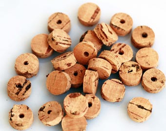 Small cork slices with or without hole, different sizes. Sustainable earth-friendly cork jewellery supplies, Portuguese cork discs.