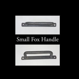 May include: A black metal handle with a curved top. The handle is labeled "Small Fox Handle".