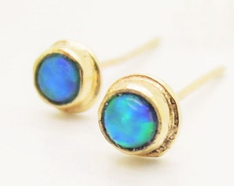 Opal stud earrings set in solid 9K Gold