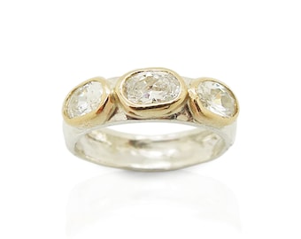 White zircon ring set 9K Gold on top of a 925 Sterling silver band