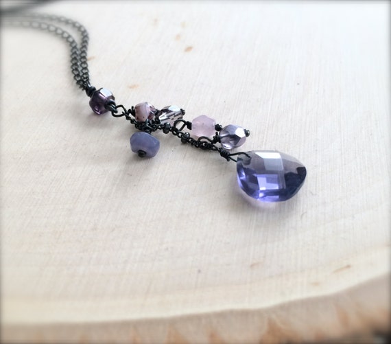 Items similar to faceted violet purple teardrop with glass beads on