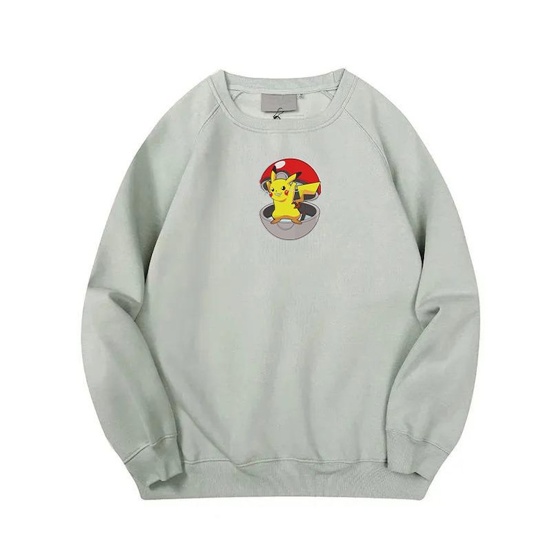 May include: A light green crew neck sweatshirt with a cartoon image of Pikachu inside a Pokeball.