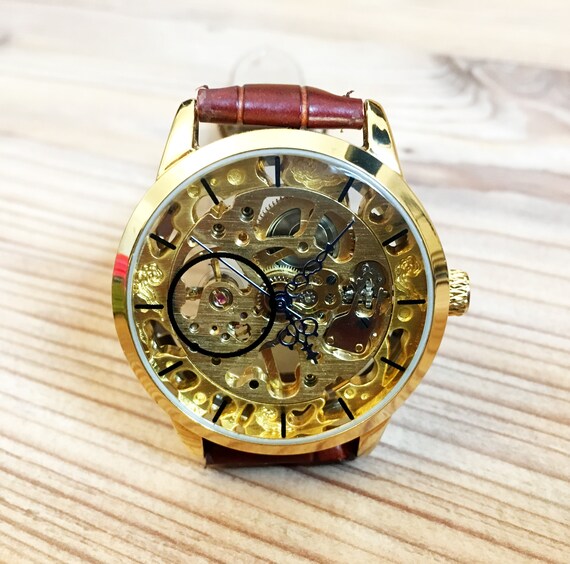 engraved skeleton watch