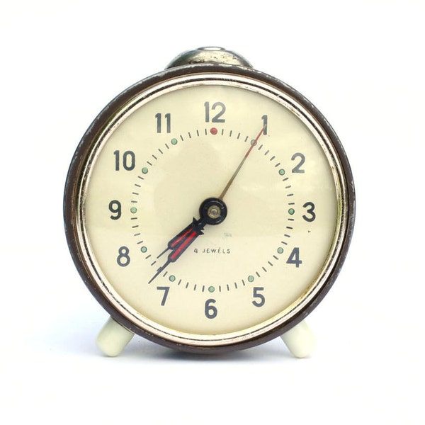 Back to school. Vintage mechanical alarm clock from Russia Soviet Union