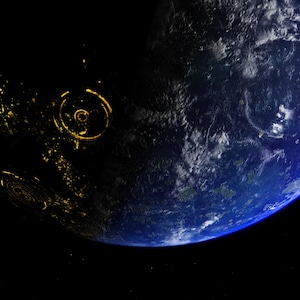 May include: A digital rendering of planet Earth in space. The image shows the Earth with a blue and white atmosphere, with the illuminated side of the planet showing yellow lights, possibly representing cities.