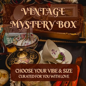 May include: A curated collection of vintage items, including a teacup with floral accents, bowls, and decorative boxes. The image features the text "VINTAGE MYSTERY BOX" and "CHOOSE YOUR VIBE & SIZE CURATED FOR YOU WITH LOVE."