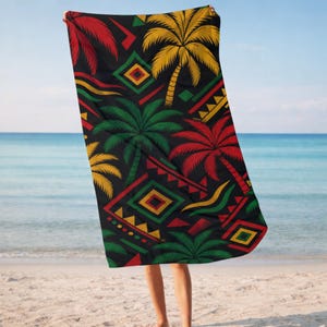 May include: A rectangular beach towel featuring a black background with a repeating pattern of palm trees and geometric shapes in vibrant red, yellow, and green. The design includes stylized palm tree silhouettes and diamond motifs.