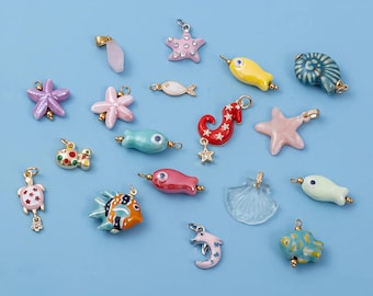 Juego de dijes de océano, dijes de mar esmaltados chapados en oro de 18 quilates, colgantes de estrella de mar, concha, delfín y pez para hacer joyas de playa.