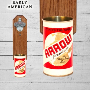 May include: Wooden wall mounted bottle opener with a metal opener and a metal can holder. The can holder has a vintage can of Arrow Premium Beer with the text "It Hits The Spot" and "The Globe's Finest Beer".