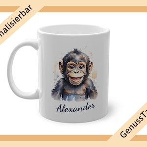 May include: White ceramic mug with a watercolor illustration of a baby chimpanzee with the name "Alexander" printed on the front.