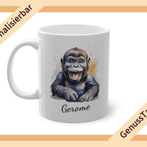 May include: White ceramic mug with a watercolor illustration of a smiling gorilla. The mug has the name "Jerome" printed on the bottom.