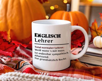 May include: White ceramic mug with a black design that says "ENGLISCH Lehrer" and a definition of the word. The definition says "Total-normaler Lehrer. Weiß wann 's mit muss. Ist unfassbar sympathisch. Allwissend. Hat grundsätzlich Recht."