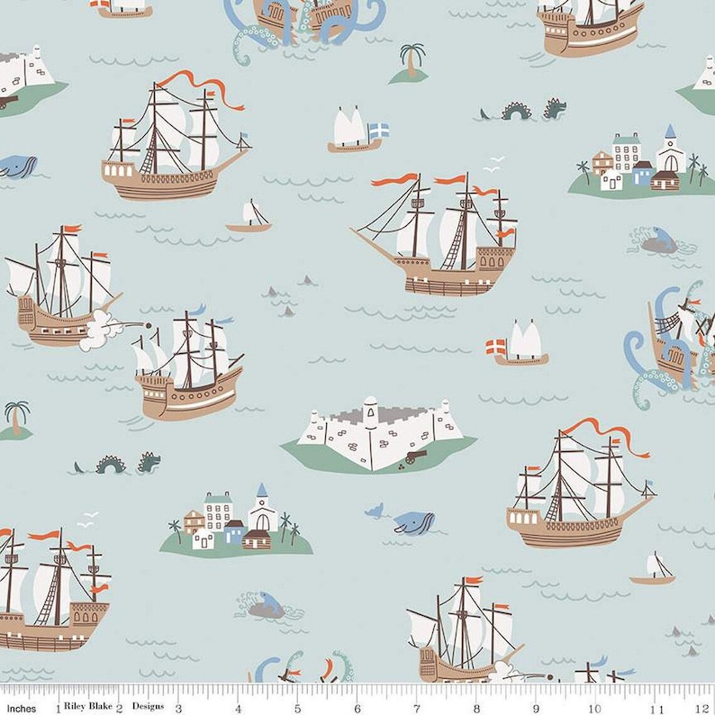 May include: A light blue fabric with a repeating pattern of sailing ships, islands, and sea creatures. The ships are brown with white sails and red flags. The islands are green with white buildings. The sea creatures are blue and brown. The fabric has a ruler printed at the bottom with inches marked.
