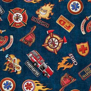 May include: A blue fabric with a repeating pattern of firefighter-themed images, including fire engines, helmets, axes, and badges. The text "FIREFIGHTER", "FIREMAN", "FD", "CHIEF", and "FIRE MARSHAL" are included in the pattern.